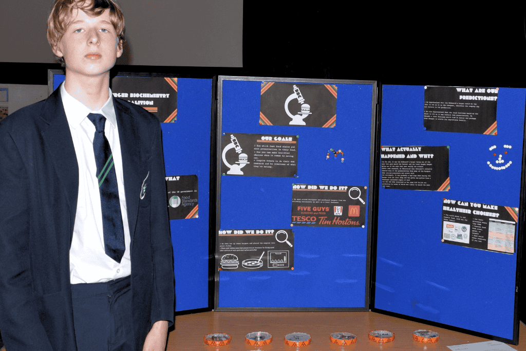 A student from Priestnall School presents his research project at the Science Fair 2024.