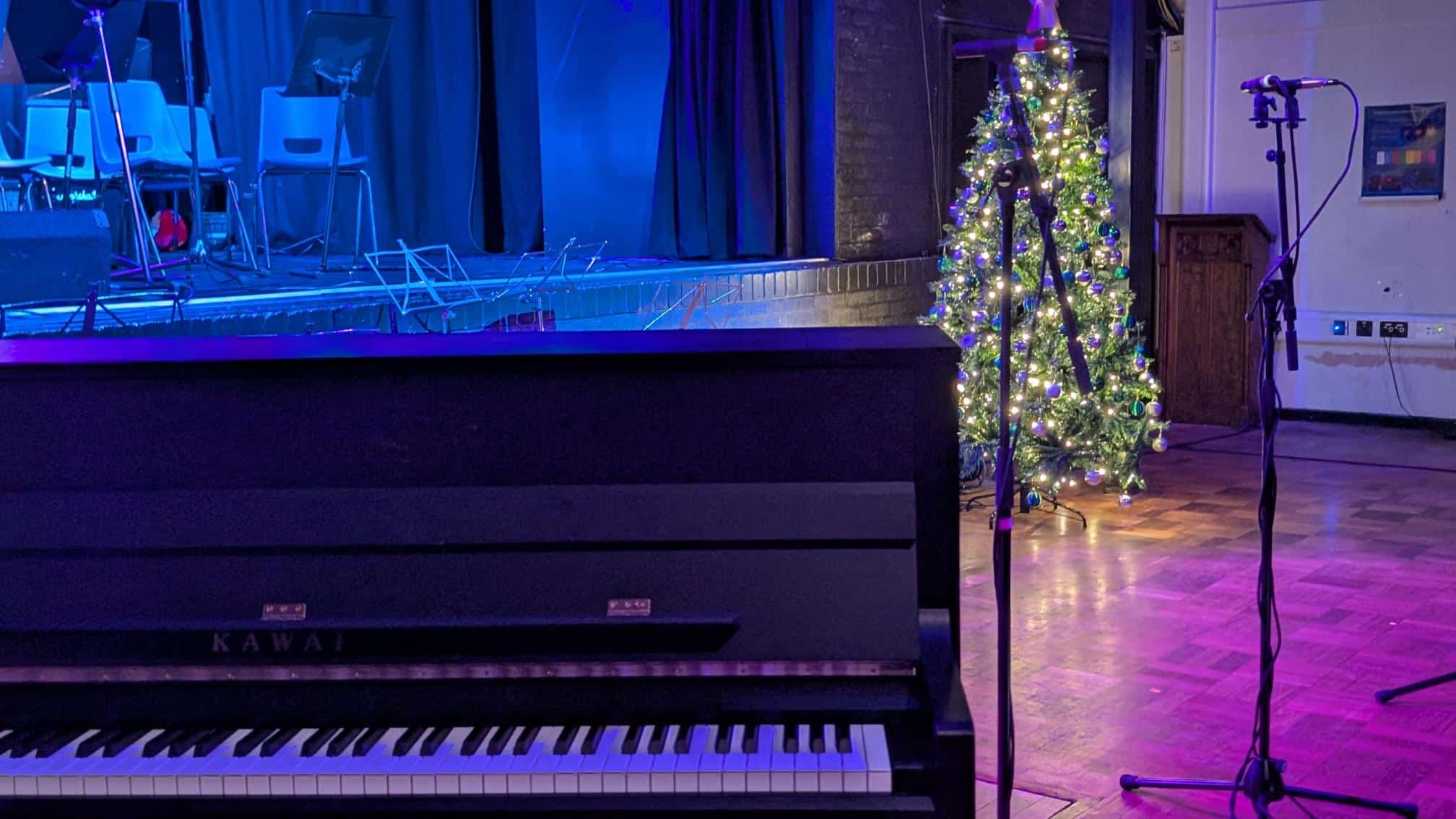 Image of piano and christmas tree